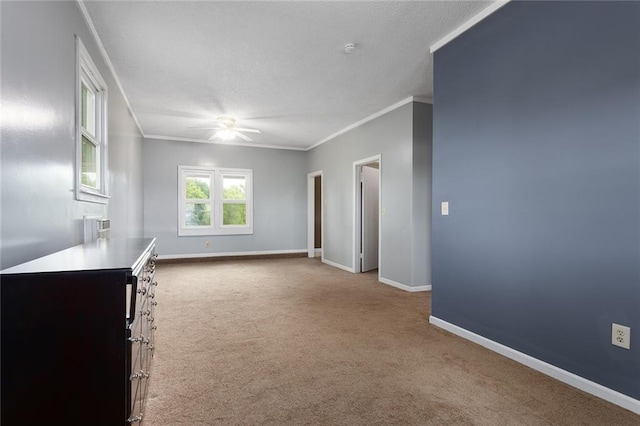 10203 Outer Rd, Odessa, MO 64076 - carpeted empty room featuring ceiling fan, ornamental molding, and a textured ceiling