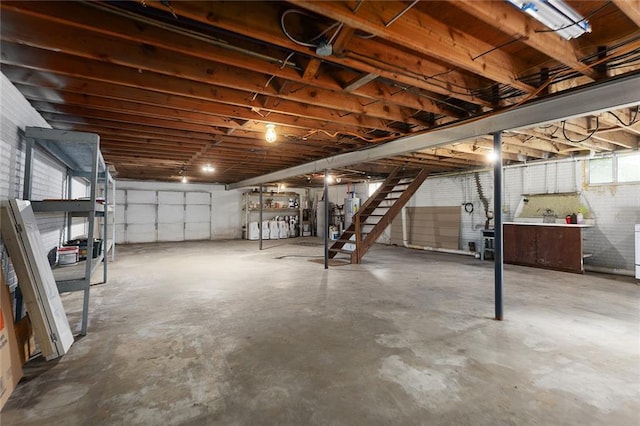 10203 Outer Rd, Odessa, MO 64076 - unfinished below grade area with stairway and gas water heater
