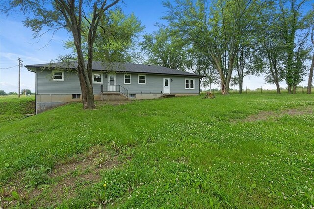 10203 Outer Rd, Odessa, MO 64076 - back of house featuring a lawn