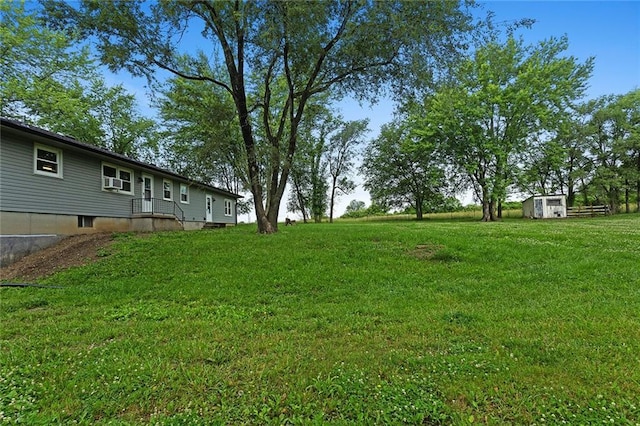 10203 Outer Rd, Odessa, MO 64076 - view of grassy yard featuring a storage unit