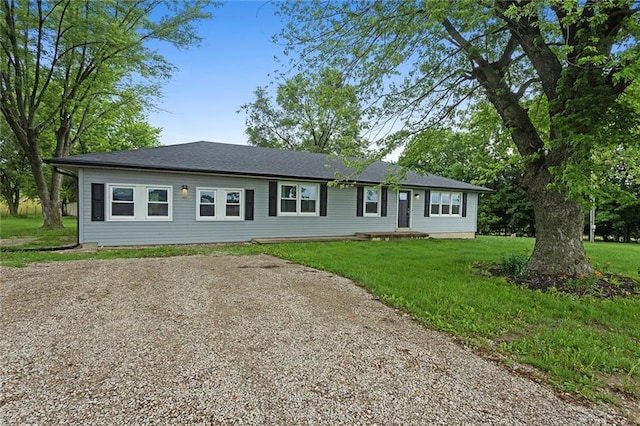 10203 Outer Rd, Odessa, MO 64076 - single story home with a front yard and gravel driveway