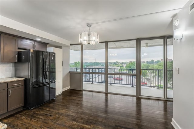 600 E Admiral Blvd Unit 601, Kansas City, MO 64106 - kitchen featuring freestanding refrigerator, dark wood finished floors, floor to ceiling windows, a chandelier, and backsplash