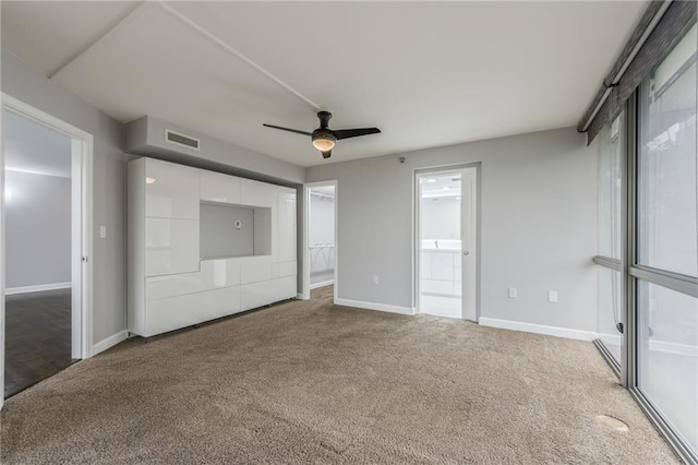 600 E Admiral Blvd Unit 601, Kansas City, MO 64106 - unfurnished bedroom with carpet, baseboards, connected bathroom, and ceiling fan