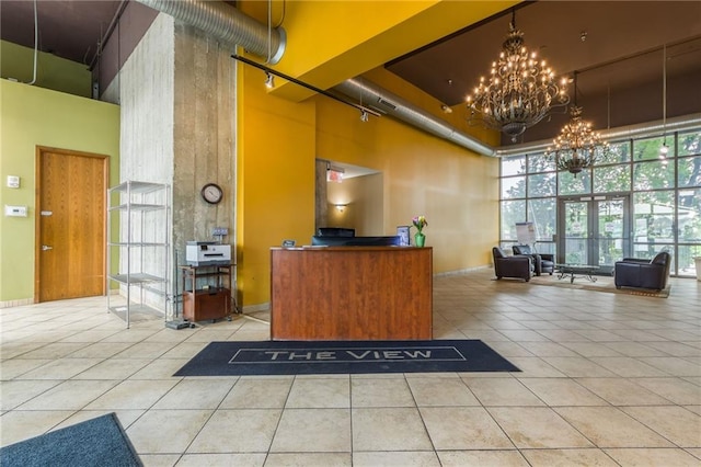 600 E Admiral Blvd Unit 601, Kansas City, MO 64106 - reception area featuring a towering ceiling, a chandelier, and expansive windows