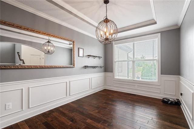 16154 S Canton St, Gardner, KS 66030 - spare room with a chandelier, crown molding, dark wood-style floors, a wainscoted wall, and a tray ceiling
