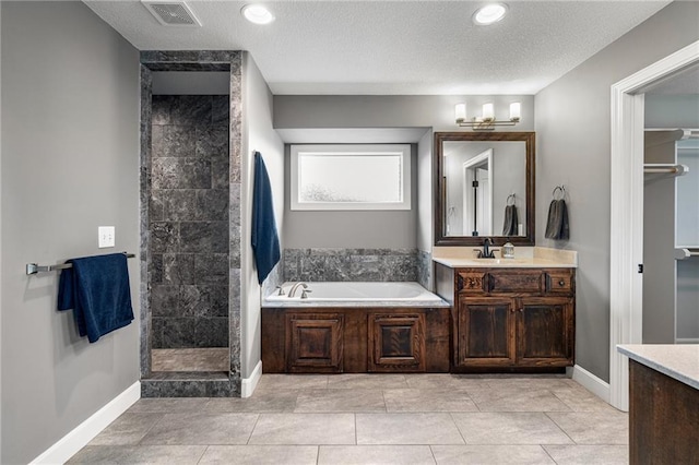 16154 S Canton St, Gardner, KS 66030 - full bathroom featuring vanity, a bath, a tile shower, recessed lighting, and a textured ceiling