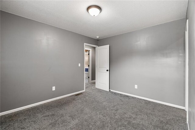 16154 S Canton St, Gardner, KS 66030 - carpeted empty room with a textured ceiling and baseboards