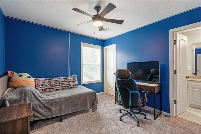16154 S Canton St, Gardner, KS 66030 - carpeted bedroom with a textured ceiling, a desk, a ceiling fan, and ensuite bath