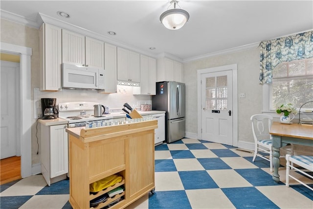 1809 Main St, Lexington, MO 64067 - kitchen featuring white appliances, light flooring, ornamental molding, light countertops, and a kitchen island