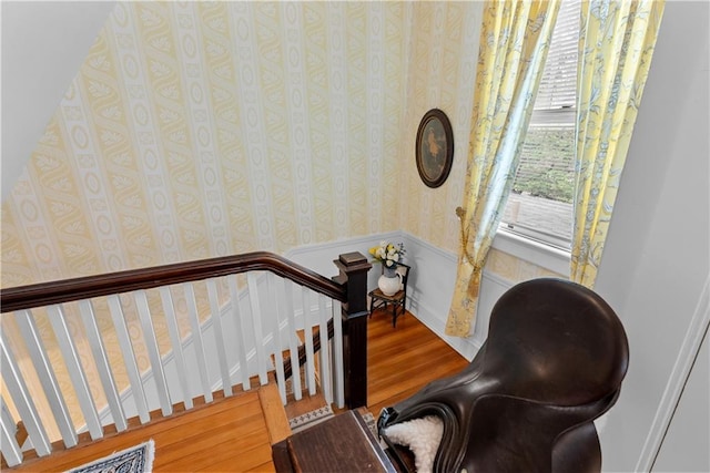 1809 Main St, Lexington, MO 64067 - staircase with wallpapered walls, wood finished floors, and a wainscoted wall