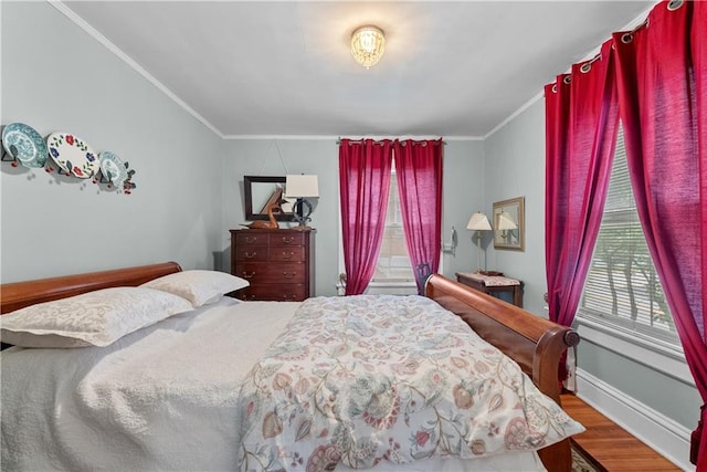 1809 Main St, Lexington, MO 64067 - bedroom with wood finished floors, crown molding, and multiple windows