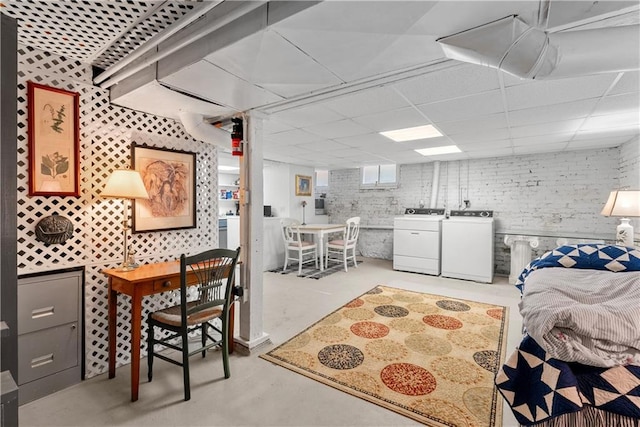 1809 Main St, Lexington, MO 64067 - bedroom with finished concrete floors, independent washer and dryer, and a drop ceiling
