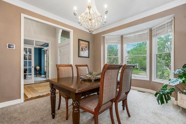 14810 W 72nd St, Shawnee, KS 66216 - dining space featuring a chandelier, light carpet, and crown molding