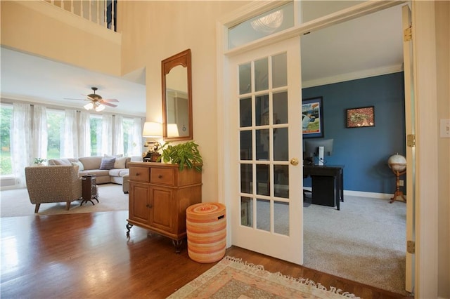 14810 W 72nd St, Shawnee, KS 66216 - interior space featuring wood finished floors, a ceiling fan, crown molding, and a desk