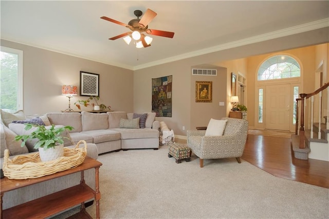 14810 W 72nd St, Shawnee, KS 66216 - living room with stairway, plenty of natural light, crown molding, carpet floors, and ceiling fan