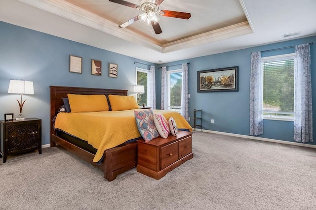 14810 W 72nd St, Shawnee, KS 66216 - bedroom with a raised ceiling, crown molding, multiple windows, light carpet, and a ceiling fan