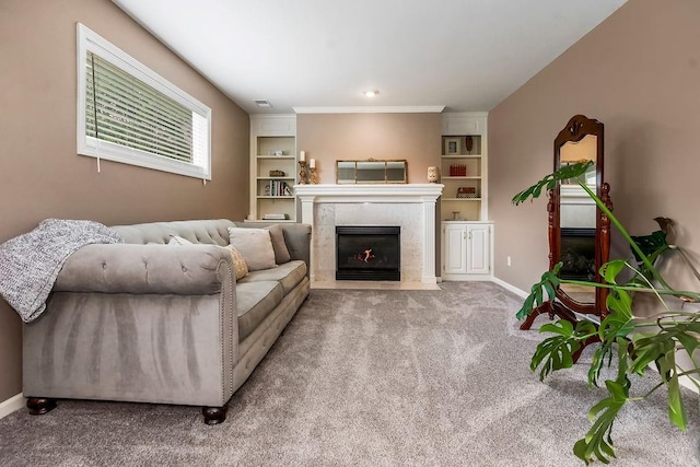 14810 W 72nd St, Shawnee, KS 66216 - carpeted living room featuring a premium fireplace, built in shelves, and crown molding