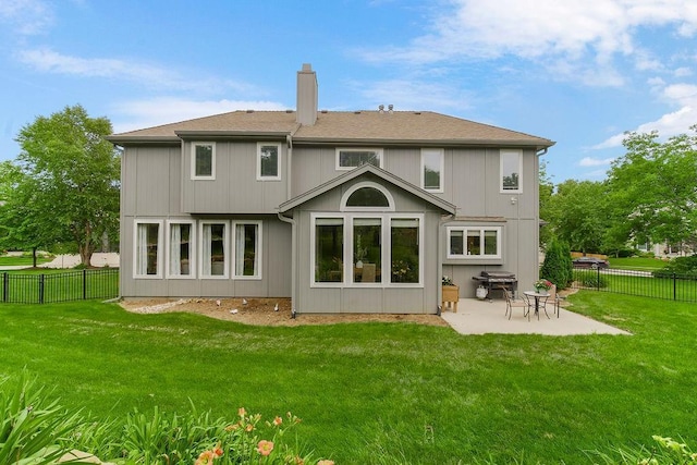 14810 W 72nd St, Shawnee, KS 66216 - back of house with a patio area, a chimney, and a fenced backyard