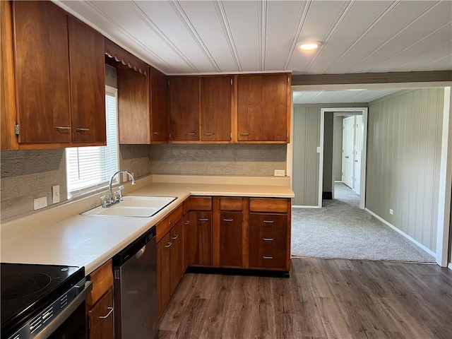 203 N Connor St, Odessa, MO 64076 - kitchen with dishwasher, a sink, light countertops, and dark wood-type flooring