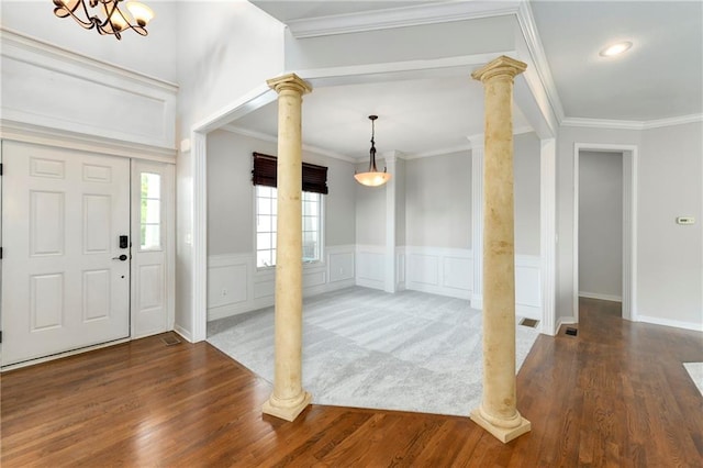 21835 W 175th Ter, Olathe, KS 66062 - entrance foyer featuring ornate columns, ornamental molding, wood finished floors, a wainscoted wall, and a decorative wall