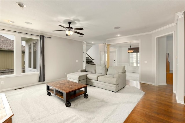21835 W 175th Ter, Olathe, KS 66062 - living area featuring ornamental molding, a ceiling fan, stairway, and wood finished floors