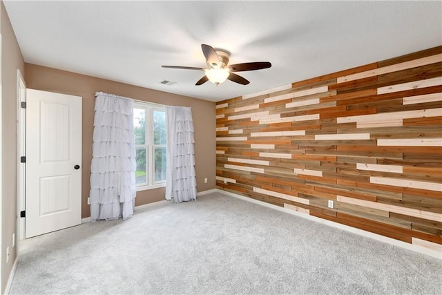 21835 W 175th Ter, Olathe, KS 66062 - carpeted spare room with wood walls and ceiling fan