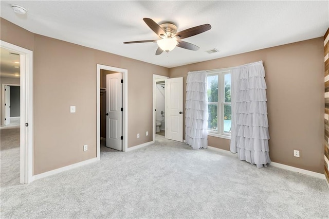 21835 W 175th Ter, Olathe, KS 66062 - unfurnished bedroom featuring carpet flooring, a walk in closet, and a ceiling fan