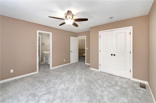 21835 W 175th Ter, Olathe, KS 66062 - unfurnished bedroom with carpet flooring, a closet, a ceiling fan, and ensuite bathroom