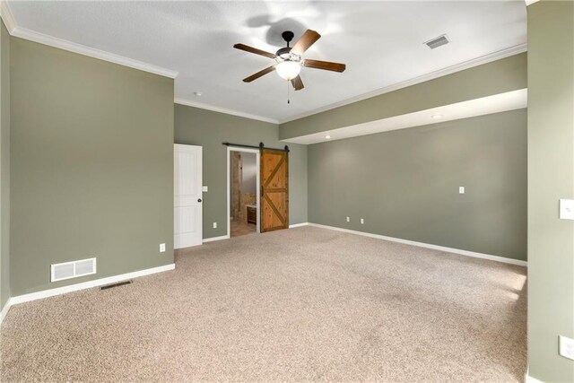 21835 W 175th Ter, Olathe, KS 66062 - unfurnished bedroom featuring a barn door, carpet floors, crown molding, ensuite bath, and ceiling fan