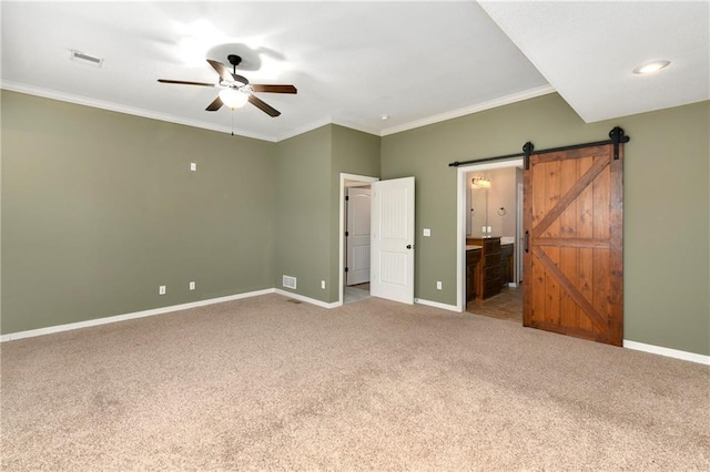 21835 W 175th Ter, Olathe, KS 66062 - unfurnished bedroom with carpet floors, ornamental molding, a barn door, ensuite bathroom, and a ceiling fan