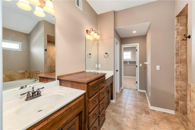 21835 W 175th Ter, Olathe, KS 66062 - bathroom featuring plenty of natural light, vanity, a bath, and tile patterned floors
