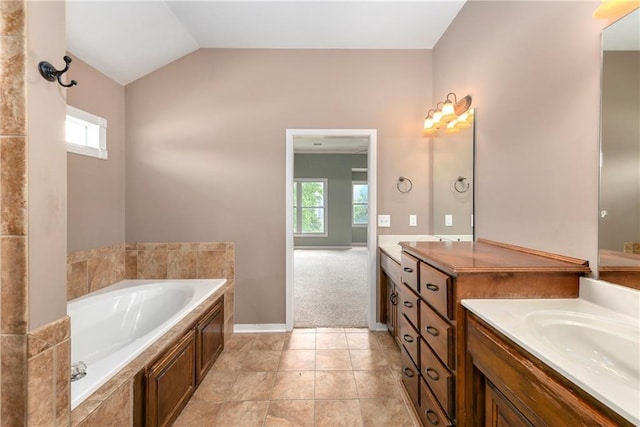 21835 W 175th Ter, Olathe, KS 66062 - bathroom featuring a bath, vanity, and vaulted ceiling