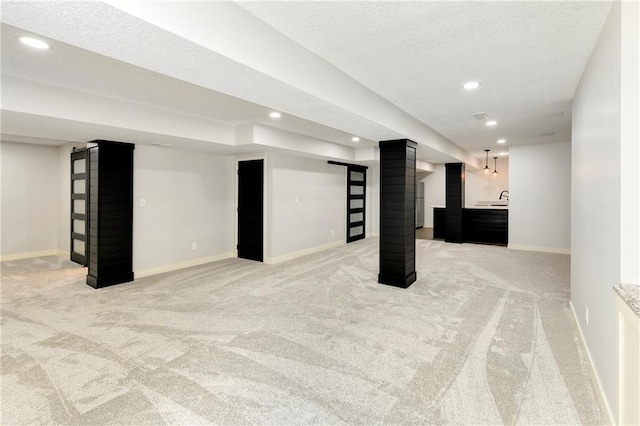 21835 W 175th Ter, Olathe, KS 66062 - finished below grade area with light colored carpet, recessed lighting, bar, and a textured ceiling