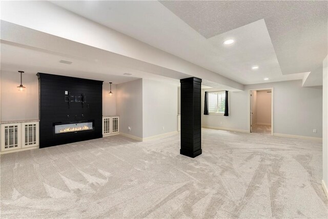 21835 W 175th Ter, Olathe, KS 66062 - basement featuring light colored carpet, a fireplace, recessed lighting, and a textured ceiling