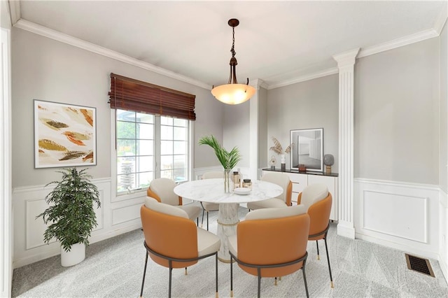 21835 W 175th Ter, Olathe, KS 66062 - dining room with light colored carpet, wainscoting, crown molding, a decorative wall, and decorative columns