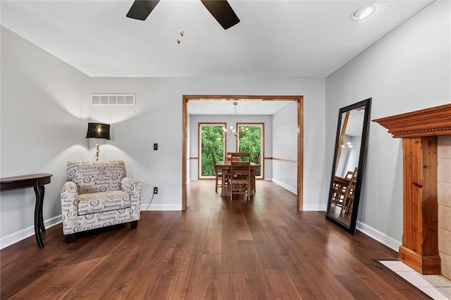 8604 NE 72nd Ter, Kansas City, MO 64158 - sitting room featuring a ceiling fan, hardwood / wood-style flooring, and baseboards