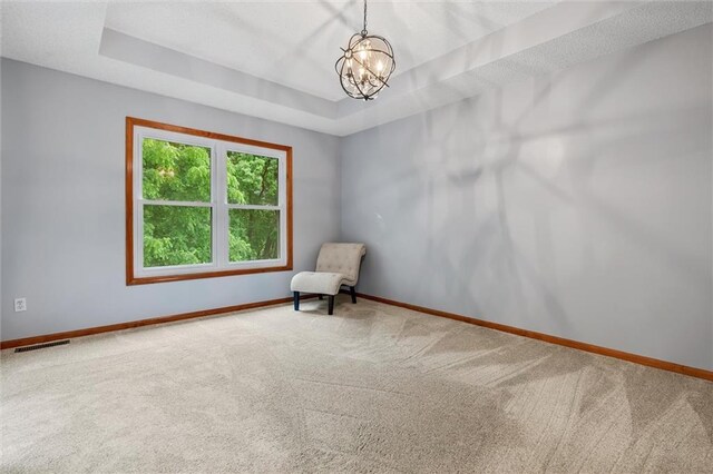 8604 NE 72nd Ter, Kansas City, MO 64158 - unfurnished room featuring carpet floors, baseboards, and a chandelier