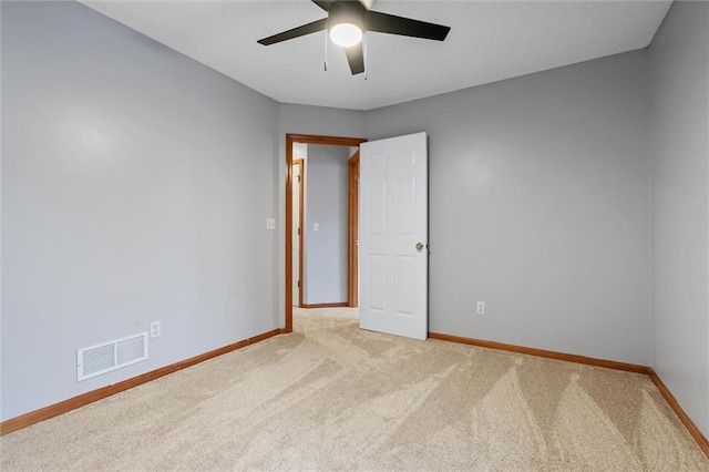 8604 NE 72nd Ter, Kansas City, MO 64158 - unfurnished room featuring light carpet, baseboards, and ceiling fan