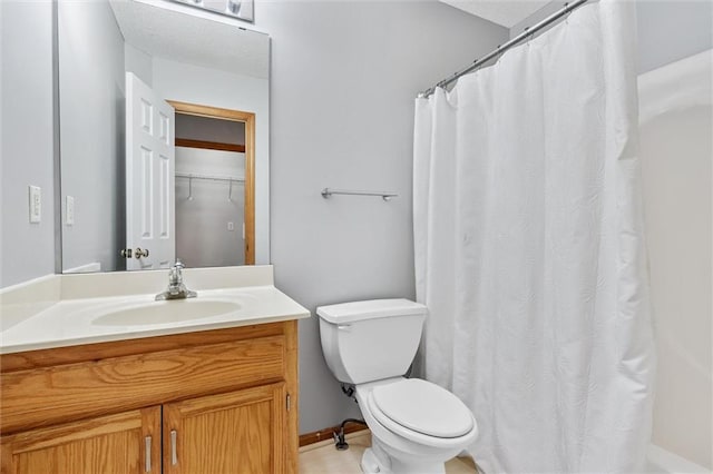 8604 NE 72nd Ter, Kansas City, MO 64158 - bathroom with vanity, toilet, and curtained shower