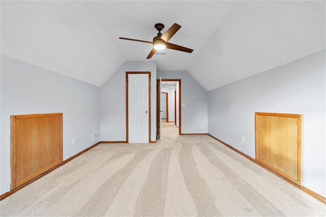 8604 NE 72nd Ter, Kansas City, MO 64158 - additional living space with a ceiling fan, lofted ceiling, baseboards, and light colored carpet