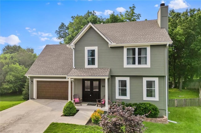 8604 NE 72nd Ter, Kansas City, MO 64158 - view of front of property featuring a garage, a chimney, a front yard, driveway, and a shingled roof