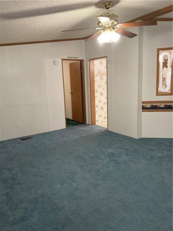 2000 E 19th St Unit 5, Lawrence, KS 66046 - carpeted empty room with ceiling fan and a textured ceiling