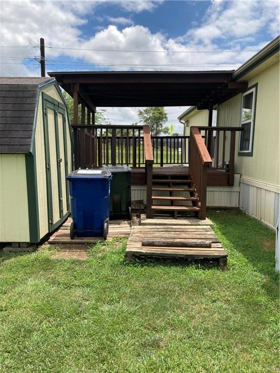 2000 E 19th St Unit 5, Lawrence, KS 66046 - wooden deck with a storage shed, a yard, and stairway