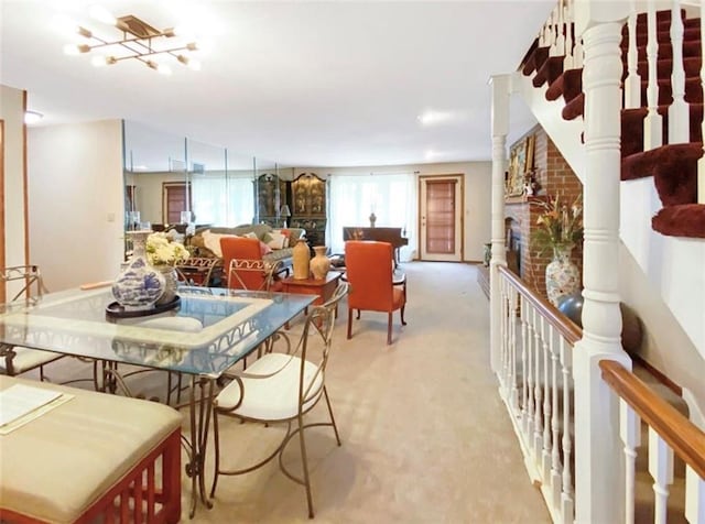 305 E Partridge Ave, Independence, MO 64055 - dining space with light carpet and a fireplace