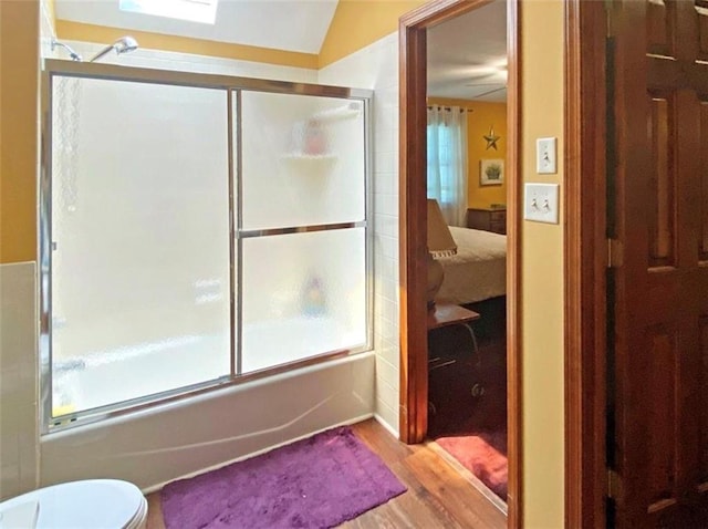 305 E Partridge Ave, Independence, MO 64055 - full bathroom with shower / bath combination with glass door, wood finished floors, ensuite bath, and toilet