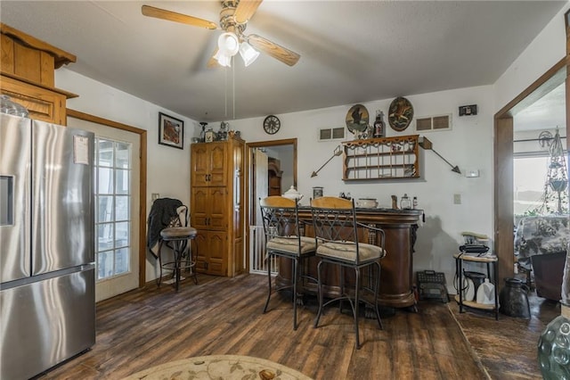 43574 E 224th St, Cowgill, MO 64637 - dining space featuring wood finished floors, ceiling fan, and a bar