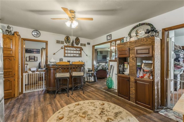 43574 E 224th St, Cowgill, MO 64637 - dining space with dark wood-style floors and a ceiling fan