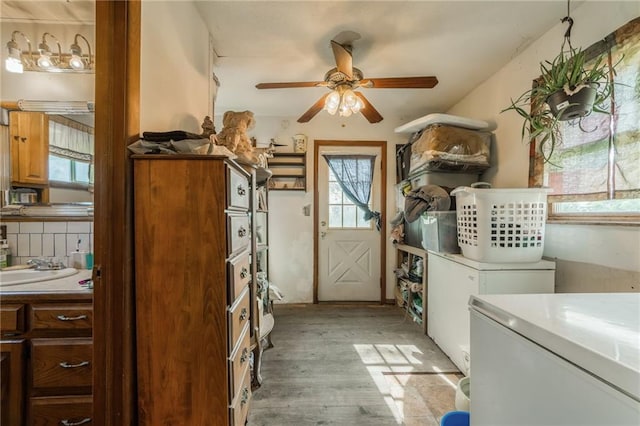 43574 E 224th St, Cowgill, MO 64637 - washroom with a ceiling fan, light wood-type flooring, and washer and dryer