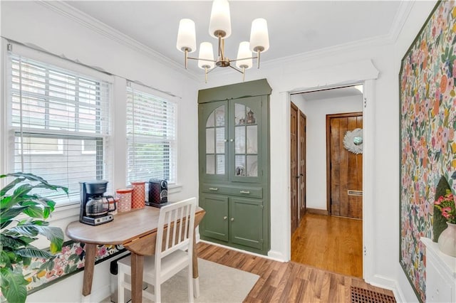 617 E 64th Ter, Kansas City, MO 64131 - home office with a chandelier, light wood finished floors, ornamental molding, and baseboards