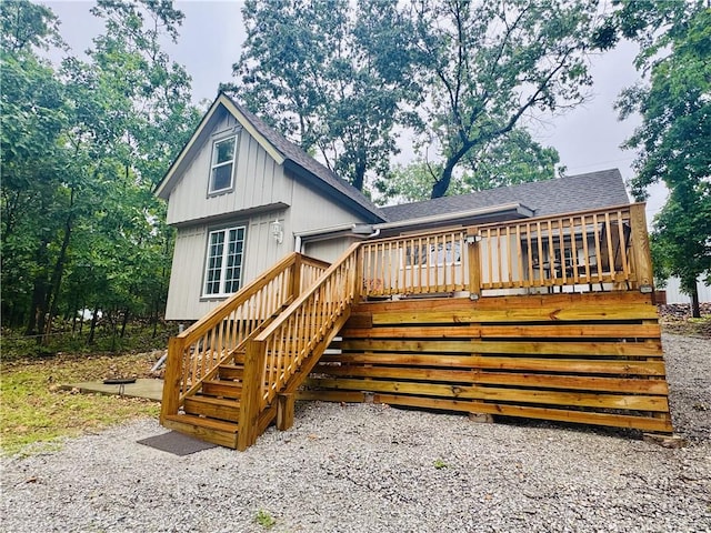 10057 Otter Rd, Clinton, MO 64735 - rear view of property featuring roof with shingles, stairs, and a wooden deck